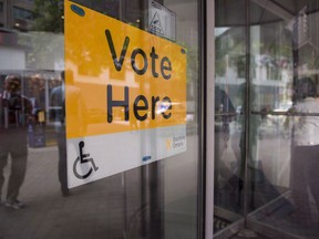 An Elections Ontario sign is seen at University - Rosedale voting location at the Toronto Reference Library on Thursday, June 7, 2018. Advance voting locations open today across Ontario as party leaders fan out across the province to pitch voters on their platforms.THE CANADIAN PRESS /Marta Iwanek