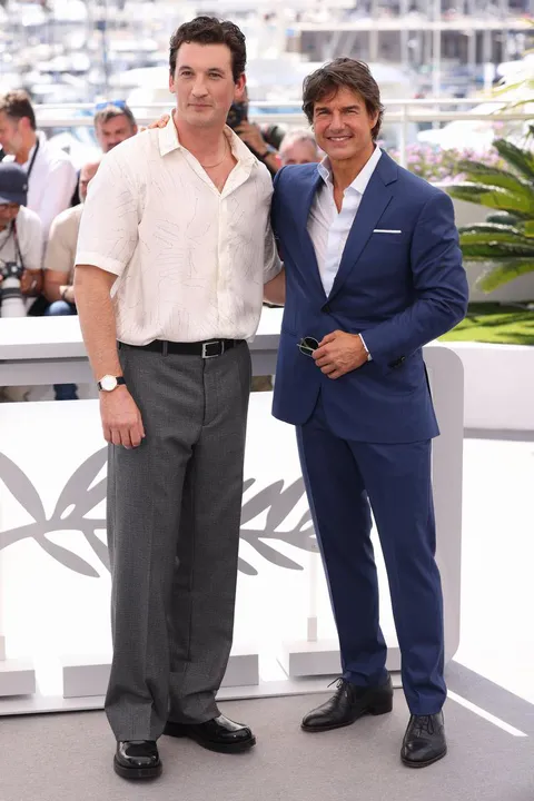 Miles Teller and Tom Cruise attend a cast photo call for "Top Gun: Maverick" during the 75th annual Cannes film festival.