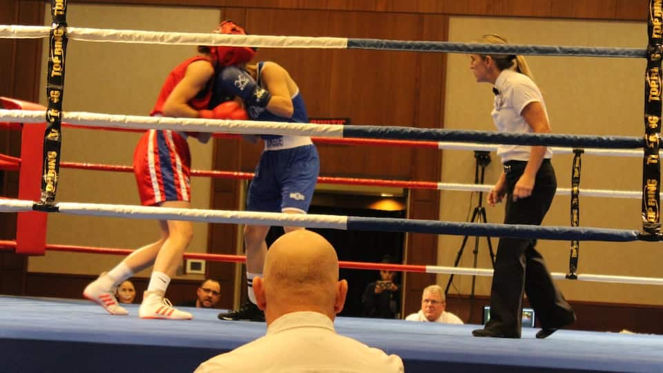 Two female boxers in an arena