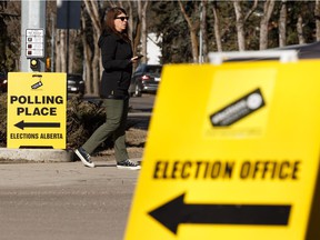 A woman leaves an advance polling location at the former Royal Alberta Museum in Edmonton on Tuesday, April 9, 2019. Advance polls are open from Tuesday to Saturday.