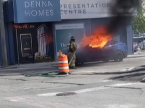 A screenshot from a video of a Tesla burning to the ground in Vancouver, BC in May 2022. Photo by Sons of Distillery Vancouver /YouTube