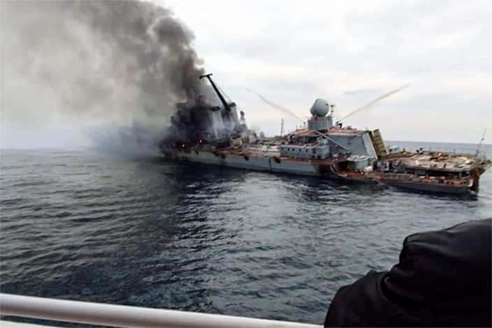 Smoke rises from the damaged Russian ship Moskva on April 15, 2022. (OSINT Technician via Twitter)