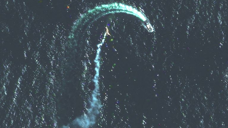 A satellite image shows a Russian Serna-class landing craft and a possible missile trail near Snake Island, Ukraine.  Photo: Maxar Technologies via Reuters