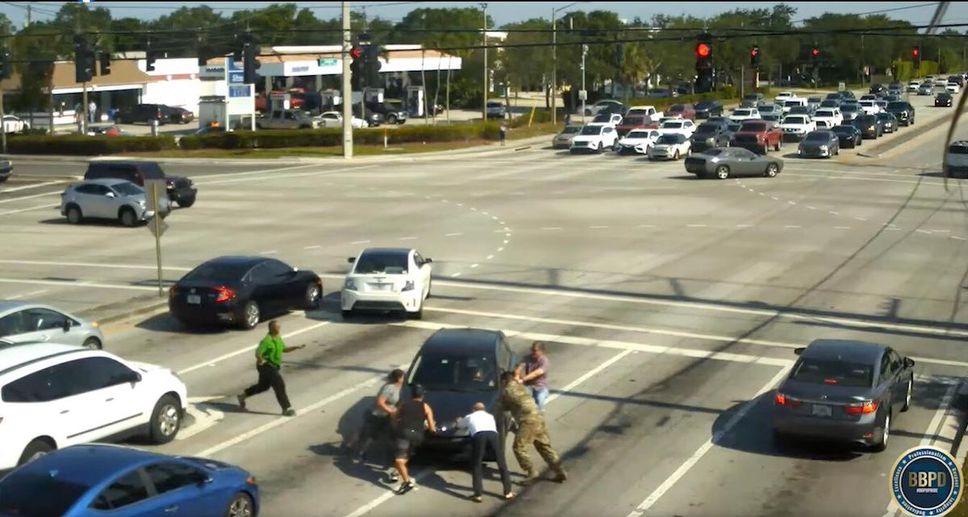 Boynton Beach police in Florida posted the video this week on Facebook in hopes of locating the Good Samaritans who rushed into live traffic to help a driver who had suffered a medical episode.