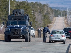 Police block the road in Debert, NS on Sunday April 19, 2020.