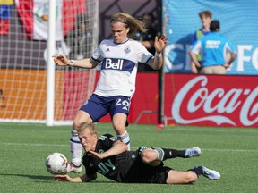 Whitecaps defender Florian Jungwirth, looming over a fallen Karol Swiderski of Charlotte FC during last Sunday's MLS game in Charlotte, NC, says the Caps want to keep their recent momentum going.  'We're on a good path,' he says.  'I feel like it's a game where whoever wants it more will get it.'