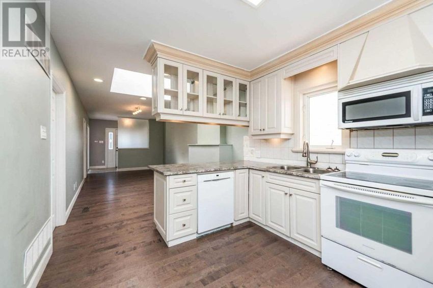The 1,200 square-foot bungalow with two bedrooms and two bathrooms features an updated kitchen, a renovated main floor bathroom and a bottom floor that could double as an in-law suite.