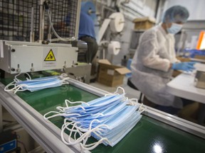 Some public health authorities, including Windsor-Essex's top doc, feel it's time to mask up again.  In this Oct. 28, 2021, file photo, local workers package level 3 surgical masks at Harbor Technologies.