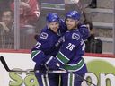 Mikael Samuelsson (right) is returning to Vancouver to work developing prospects, while Daniel Sedin (left) and his brother Henrik are moving into the player development department.