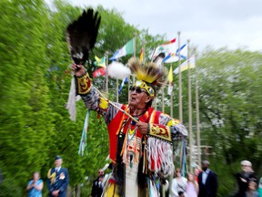 Traditional dancer Myles Rain performs during a garden party in celebration of Her Majesty the Queen's 70 years of service, hosted by Lieutenant Governor Salma Lakhani at Government House, in Edmonton Saturday, June 4, 2022. Photo By David Bloom