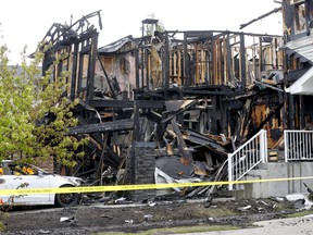The Calgary Fire investigates a fire on Evansmeade Common NW that destroyed multiple homes in the Calgary community of Evanston on Saturday, June 4, 2022.