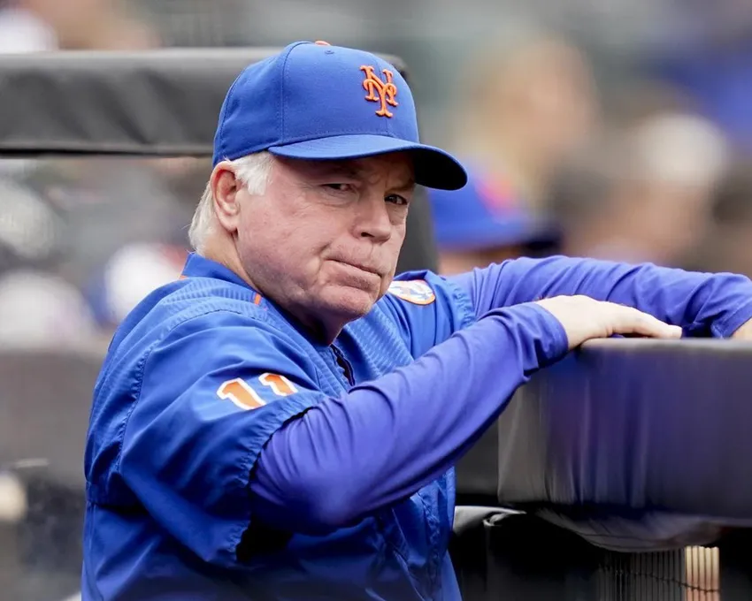 New York Mets manager Buck Showalter (11) works in the dugout in the fifth inning of a baseball game against the Washington Nationals, Wednesday, June 1, 2022, in New York.