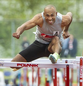 Damian Warner's left foot catches the hurdle during 110 meter hurdle at Harry Jerome Track Classic at Swangard Stadium in Burnaby, BC., June 14, 2022.