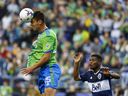 Seattle Sounders FC defender Jackson Ragen (25) wins a header against Vancouver Whitecaps forward Deiber Caicedo (7) during the first half at Lumen Field.  Mandatory Credit: Joe Nicholson-USA TODAY Sports