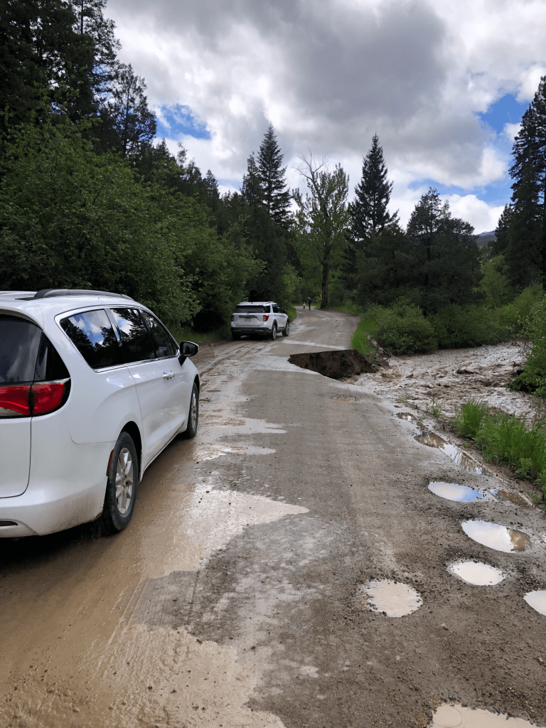 cars on washed out road
