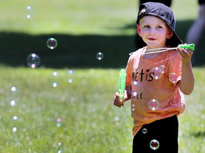Charles Romat, 3, has some fun with bubbles at the Windsor Indigenous Solidarity Day event at the Mic Mac Park on Tuesday, June 21, 2022.