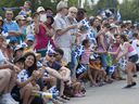 Crowds line Sherbrooke Street at the annual Fête nationale parade in Montreal on Monday, June 24, 2013.