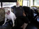 Guylain Levasseur, 56, and dog Misha sit in the lounge area of ​​his motorhome.  “People can't stand to see suffering,