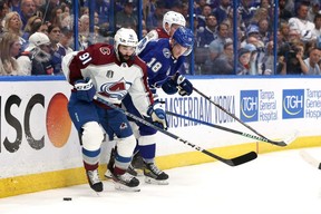 Avalanche forward Nazem Kadri, left, defends against Ondrej Palat, right, of the Lightning during the third period in Game 4 of the Stanley Cup Final at Amalie Arena in Tampa, Fla., Wednesday, June 22, 2022.