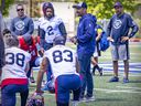 Montreal Alouettes head coach Khari Jones addresses players at the end of a training camp practice in Trois-Rivières on May 25, 2022.