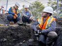 Archeologist Brenden Di Vittori consults with project co-managers Pascale Vaillancourt, left, and Julie Fournier at archeological dig on St-Joachim Ave. in Pointe-Claire Village, on Friday.