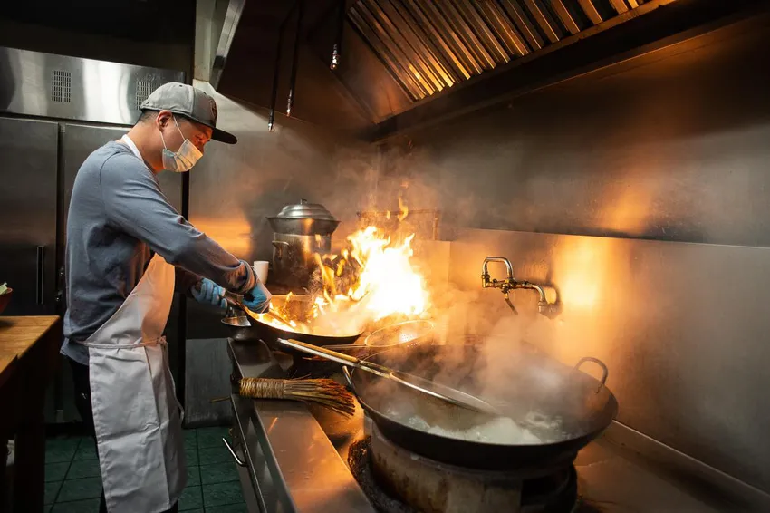 Saigon Flower's chef Paul Chen fires up the wok to make Cantonese chow mein.