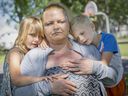 Windsor has become expensive for those seeking affordable rents.  Michelle Potter, is shown Friday, June 17, 2022, with her children de ella, David, 6, and Hope, 5, in Kinsmen Park across from Hiatus House where they are currently staying.