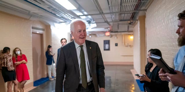 Sen. John Cornyn, R-Texas, arrives on Capitol Hill to meet with Sen. Chris Murphy, D-Conn., and Sen. Kyrsten Sinema, D-Ariz., for more bipartisan talks on curbing gun violence.  in Washington, Wednesday, June 15, 2022. 