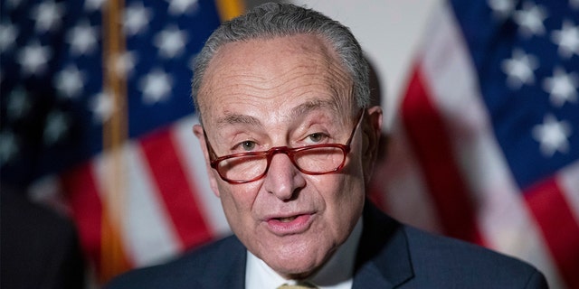 Senate Majority Leader Chuck Schumer, DN.Y., answers questions from reporters during a news conference Tuesday, Jan. 18, 2022.