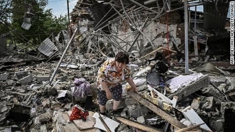 Residents search through the rubble of their house for their belongings after a strike destroyed three houses in the city of Sloviansk, in the Donbas region of eastern Ukraine, on June 1.