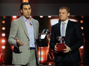 Goalies Roberto Luongo (left) and Cory Schneider of the Vancouver Canucks accept the William M. Jennings Trophy for lowest goals against totals at the 2011 NHL Awards in Las Vegas.