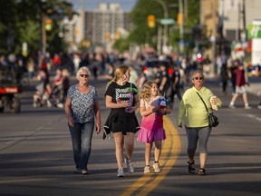 Police closed down roads in the hours ahead of Monday night's fireworks show, and downtown streets began being taken over by pedestrians, cyclists, strollers and inline skaters ahead of the evening pyrotechnics.