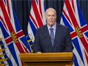 Premier John Horgan, pictured during a February 2022 news conference in Victoria.