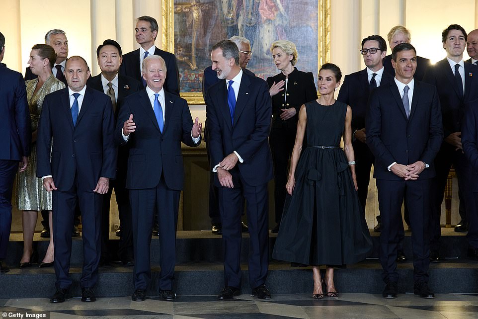 President Biden jokes with the King of Spain before the official family photo