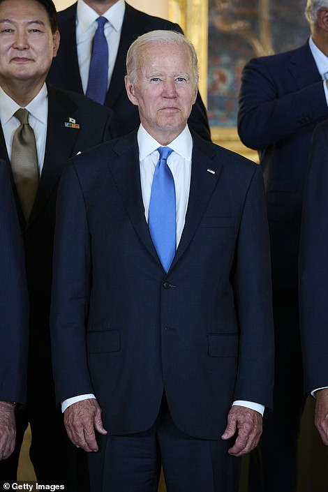 Biden looks on during the team photo at the royal palace in Madrid