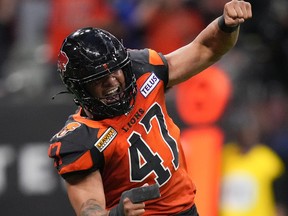BC Lions' Sione Teuhema celebrates after sacking Edmonton Elks quarterback Nick Arbuckle during the second half of CFL football game in Vancouver, on Saturday, June 11, 2022.