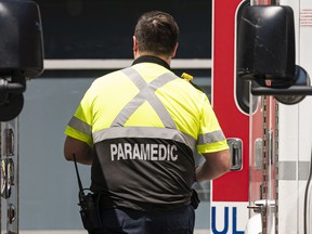 A paramedic wearing the new uniform arrives at St. Paul's Hospital in Vancouver on June 27.