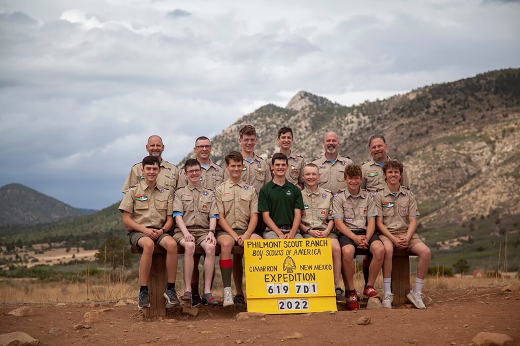 Scouts take photos of the crew in front of the Tooth of Time at the Philmont Scout Ranch on June 19, 2022.