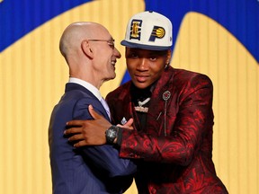 Montreal's Bennedict Mathurin is greeted by NBA commissioner Adam Silver (left) after being selected as the sixth overall pick by the Indiana Pacers at the 2022 NBA Draft in Brooklyn, NY, on Thursday.