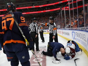 Nazem Kadri #91 of the Colorado Avalanche is tended to for an injury as they take on the Edmonton Oilers in the first period in Game Three of the Western Conference Final of the 2022 Stanley Cup Playoffs at Rogers Place on June 04, 2022 in Edmonton, alberta.