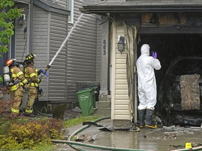 Fire investigators were on scene at a residential house fire on Monday, June 6, 2022, at 663-178 St. SW in Edmonton.  Larry Wong/Post Media
