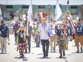 First Nations members hold a ceremony on a portion of the Ambassador Bridge while bridge traffic was briefly halted on Tuesday, June 28, 2022. The Jay Treaty Border Alliance is meeting in Windsor to discuss cross-border travel for First Nations people.