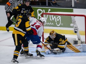 Marco Costantini (33) of the Hamilton Bulldogs makes the save against Josh Williams (14) of the Edmonton Oil Kings during the second period of the Round Robin game 5 of the 2022 Memorial Cup between the Hamilton Bulldogs vs the Edmonton Oil Kings on June 24 , 2022, at the Harbor Station in Saint John, NB.