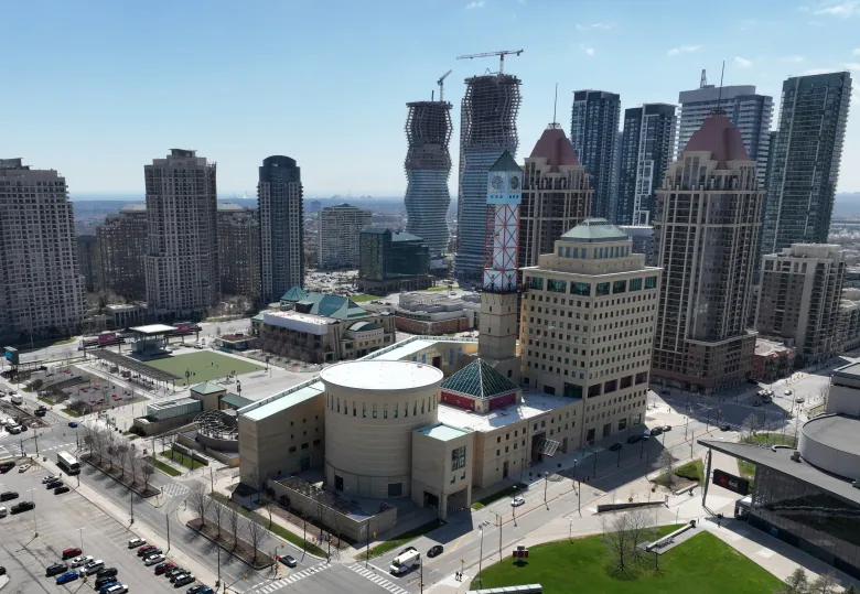 Aerial shot of Mississauga City Hall, surrounded by residential highrises.