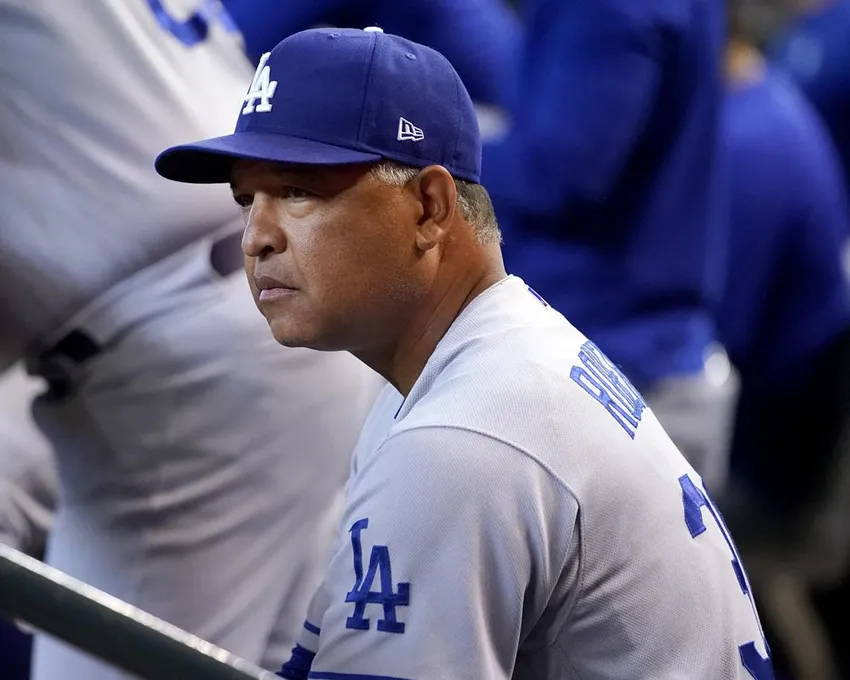 Los Angeles Dodgers manager Dave Roberts watches the game during the second inning of a baseball game against the Arizona Diamondbacks Saturday, May 28, 2022, in Phoenix.