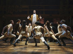 Julius Thomas III, centre, plays Alexander Hamilton in the touring production of Hamilton which opened at Edmonton's Jubileee Auditorium Wednesday night.