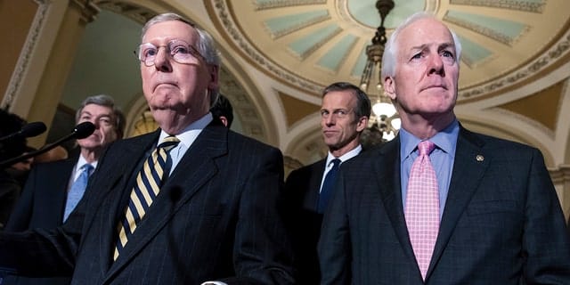 Sen. Mitch McConnell, R-Kentucky, left, and Sen. John Cornyn, R-Texas, right, speak to reporters following a closed-door policy meeting on Capitol Hill in Washington on Tuesday, March 8. from 2016. 