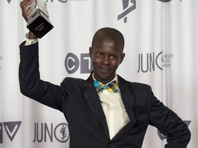 Karim Ouellet celebrates his Juno Award for Francophone Album of the year during the Juno Gala in Winnipeg on Saturday, March 29, 2014.