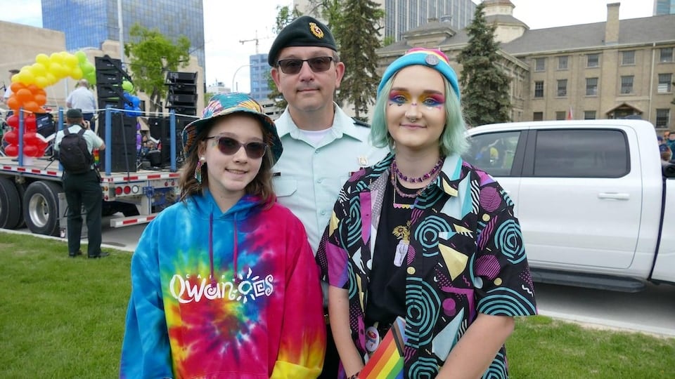 Chloe Minkley, her sister and her father at the Winnipeg Pride Parade on June 5, 2022. 