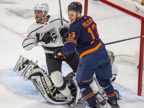 Edmonton Oilers Jesse Puljujarvi (13) battles with Los Angeles Kings Matt Roy (3) in front of goaltender Jonathan Quick (32) during first period NHL playoff action on Tuesday, May 10, 2022 in Edmonton.